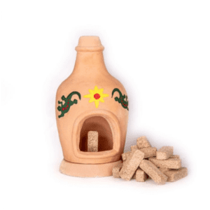 A small, painted CHIMINEA INCENSE BURNER with an open front and a pile of 40 rectangular PINON INCENSE BRICKS beside it.