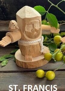 A wooden statue of an angel with arms outstretched.